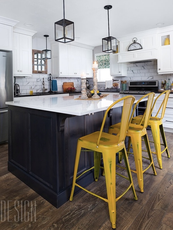 Finished kitchen with black and white cabinets and granite counter tops with yellow barstools