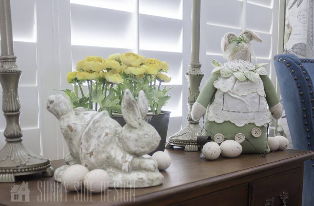Decorate for Easter with classic bunny Easter decor and faux spring flowers.
