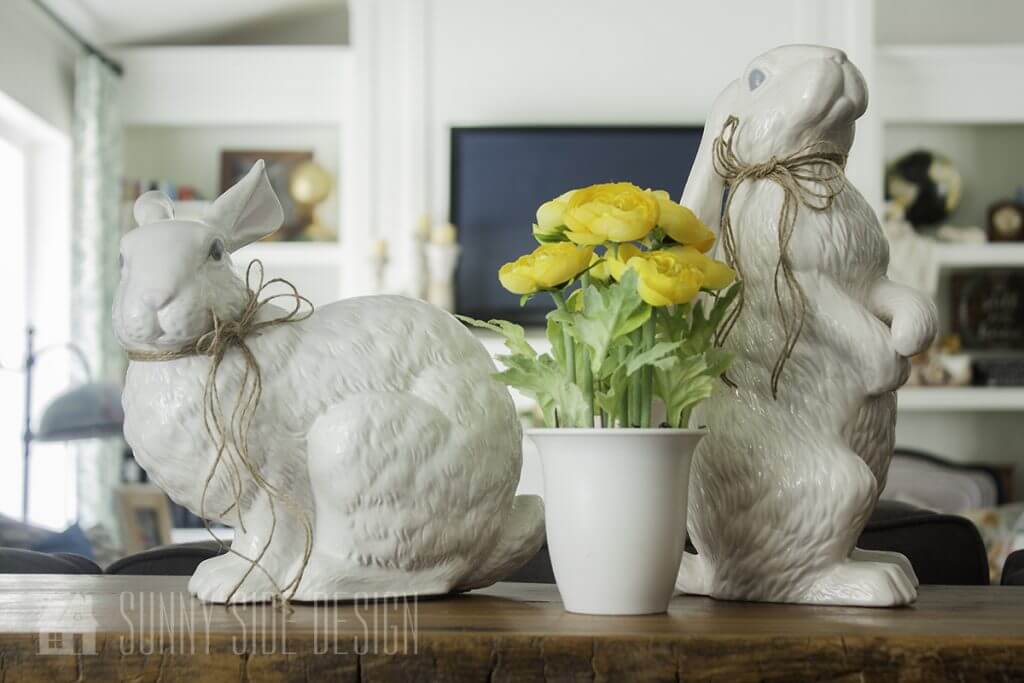 Decorate for Easter with classic Easter bunnies and faux spring flowers.
