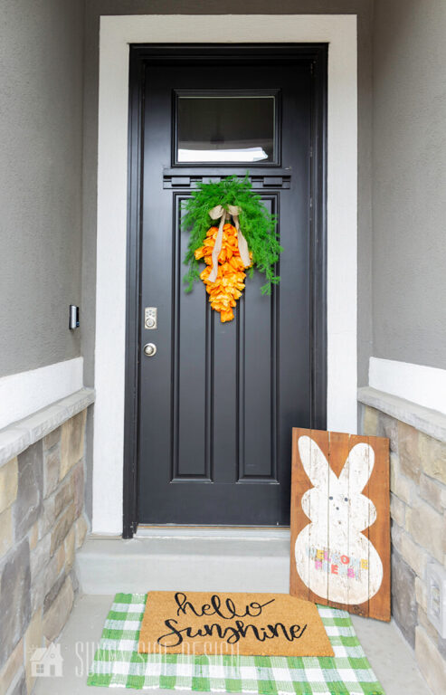 Decorate for Easter, front porch decorated for Easter with a tulip carrot reath and a peep bunny welcome sign.