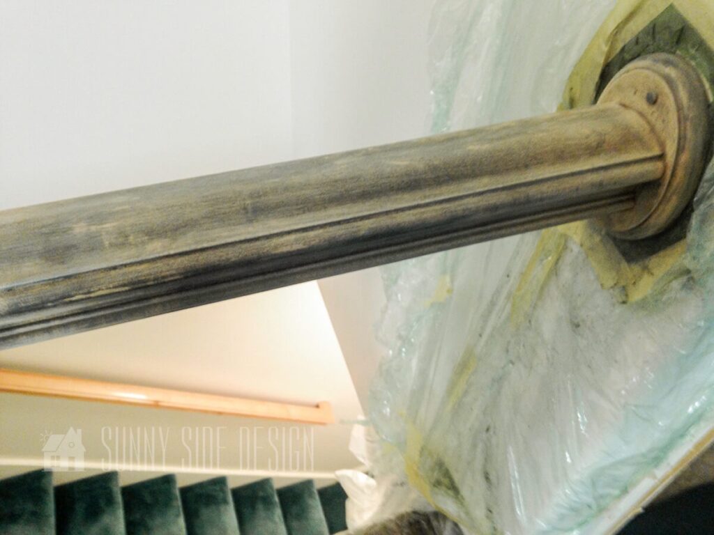 banister lightly stained and sanded