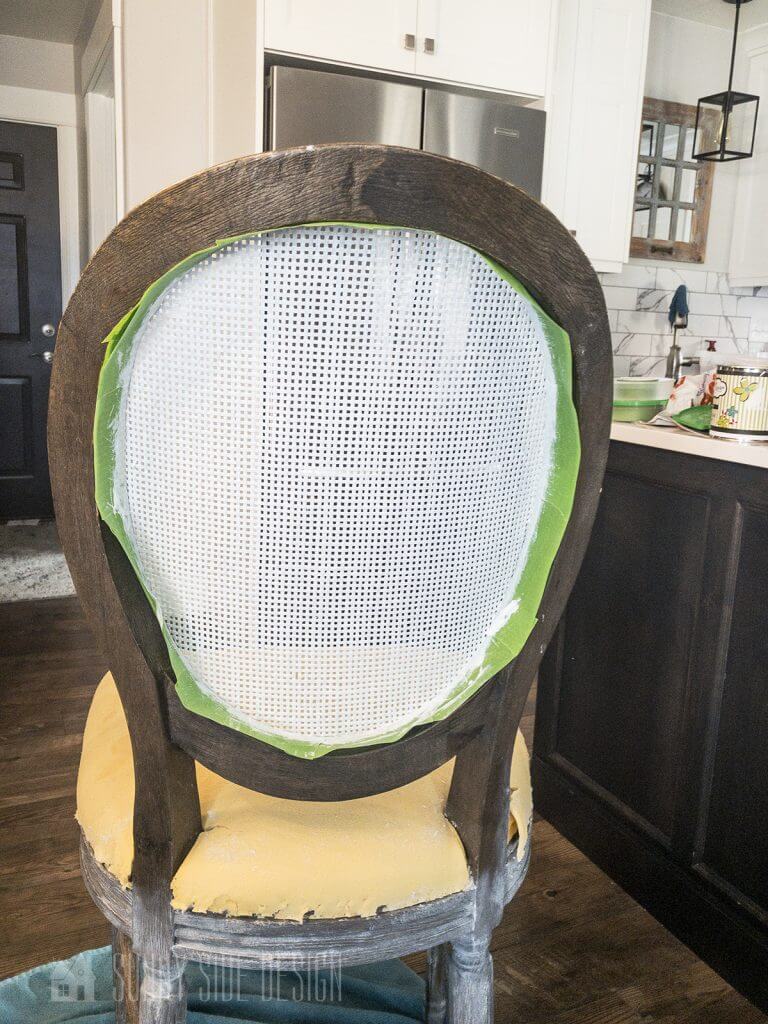 painting the cane on the bar stool backs to give it a fresh new look