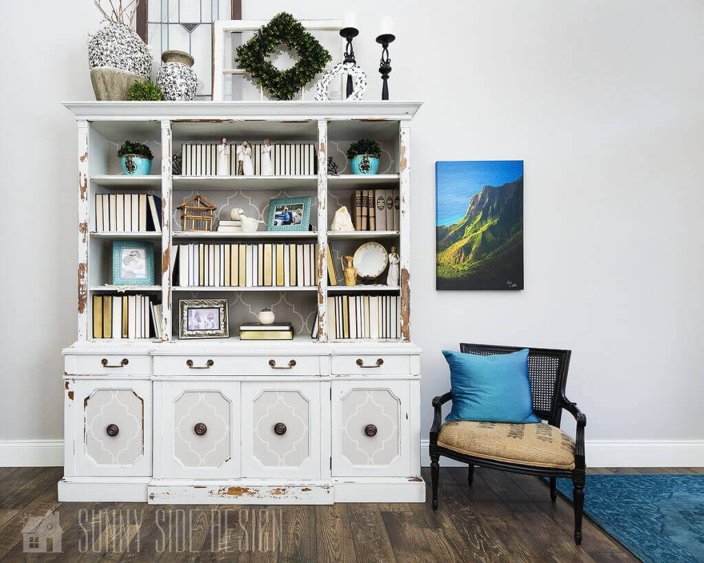 Flea market flip ideas, vintage dining hutch it repurposed into a bookcase with white chalk paint and gray and white wallpaper