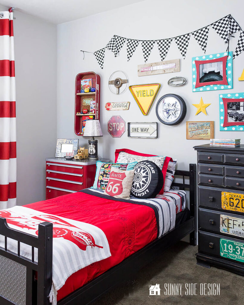 Black bed after repair of a broken bed rail, in a cars themed little boys bedroom.