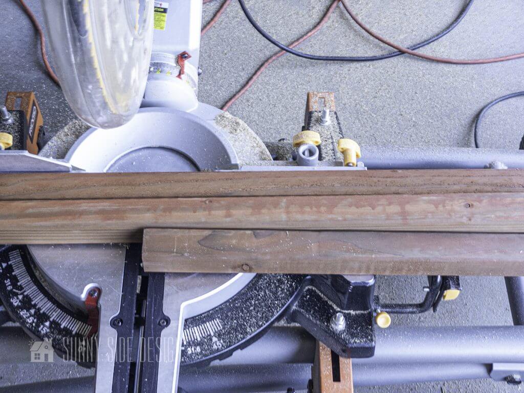 Trellis boards are cut to length with the chop saw.
