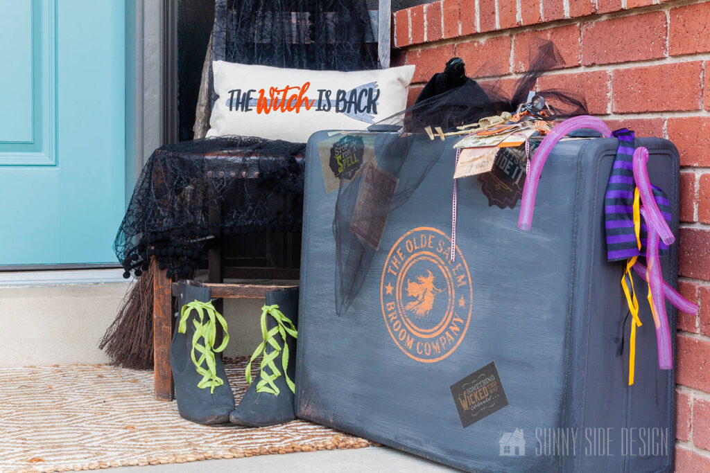 Halloween decorations on the front porch for a witch themed Halloween party.