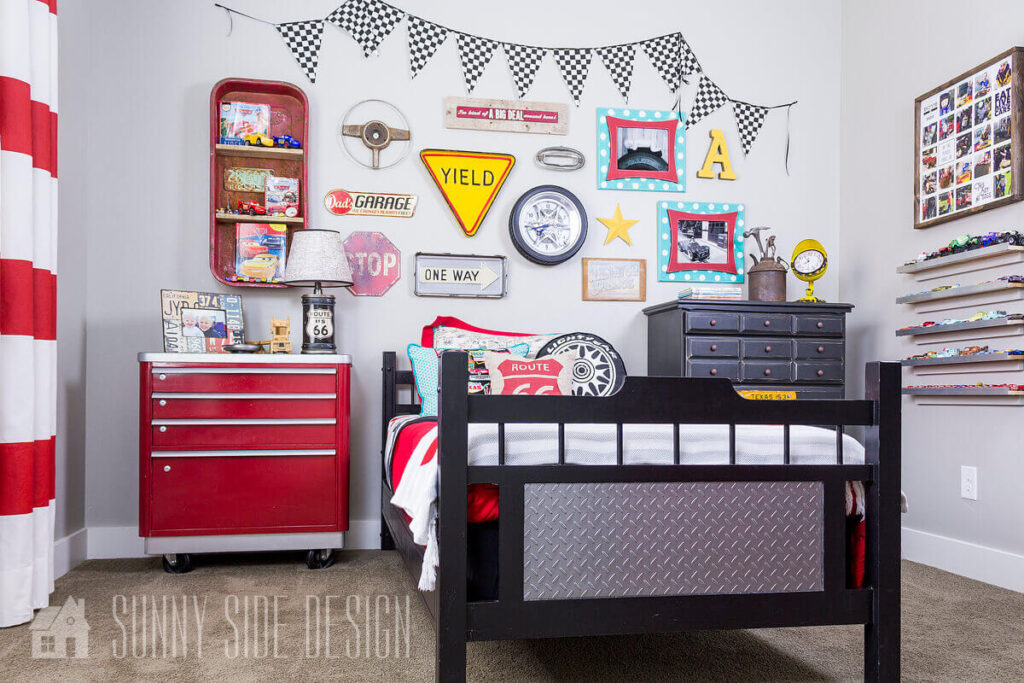 Updated lateral filing cabinet with glossy red and silver paint is now a tool chest dresser in this fun cars themed little boys bedroom.