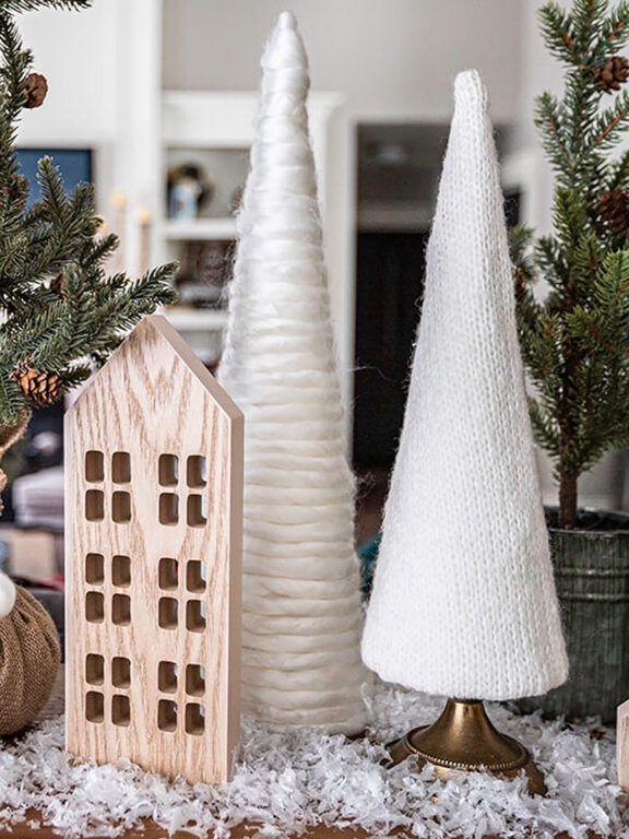 DIY cozy Christmas decor trees made from chunky yarn and an old sweater.