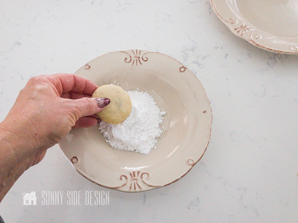 When cookies are completely cooled, coat each cookie with powdered sugar.