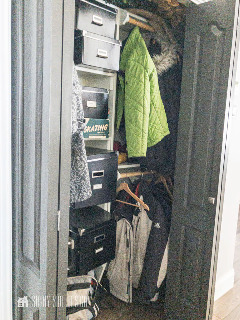 Coat closet before implementing organization ideas.