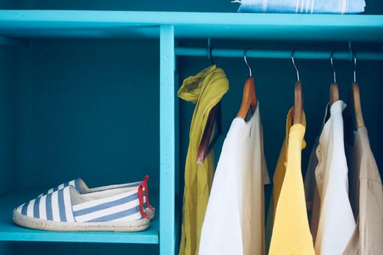 Declutter your home in 4 Easy Steps, organized clothes closet.