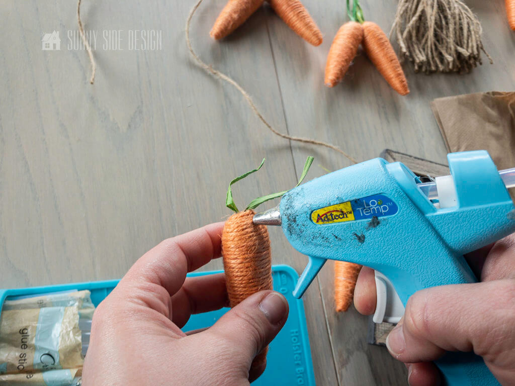 Attach twine carrots to the Easter bunting.