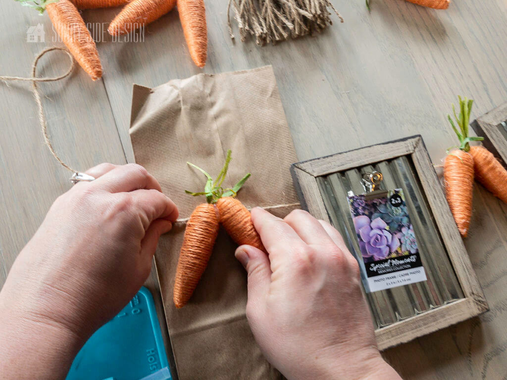 Attach twine carrots to the Easter bunting.