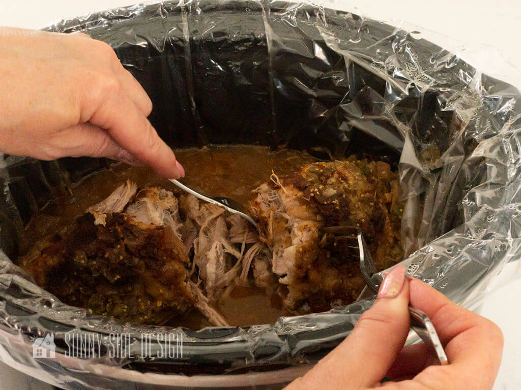 Crockpot Pork Loin Recipe, shred cooked pork with two forks