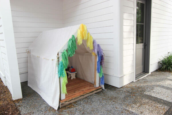 Backyard Ideas, create a DIY playhouse for the kids with pallet wood and fabric.