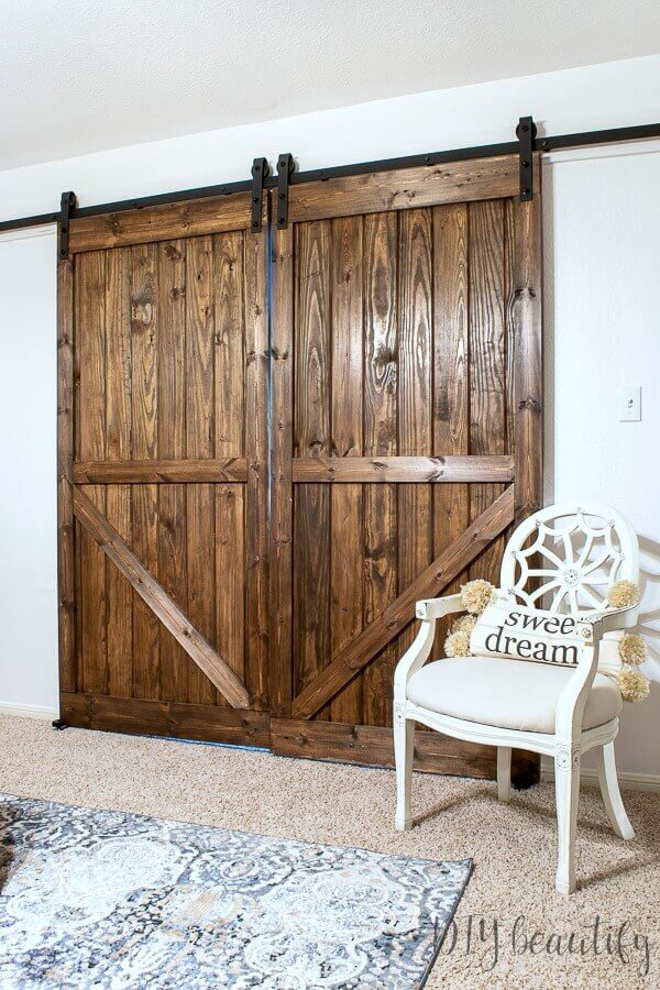 Rustic Barn Door Ideas, stained wood with black hardware.