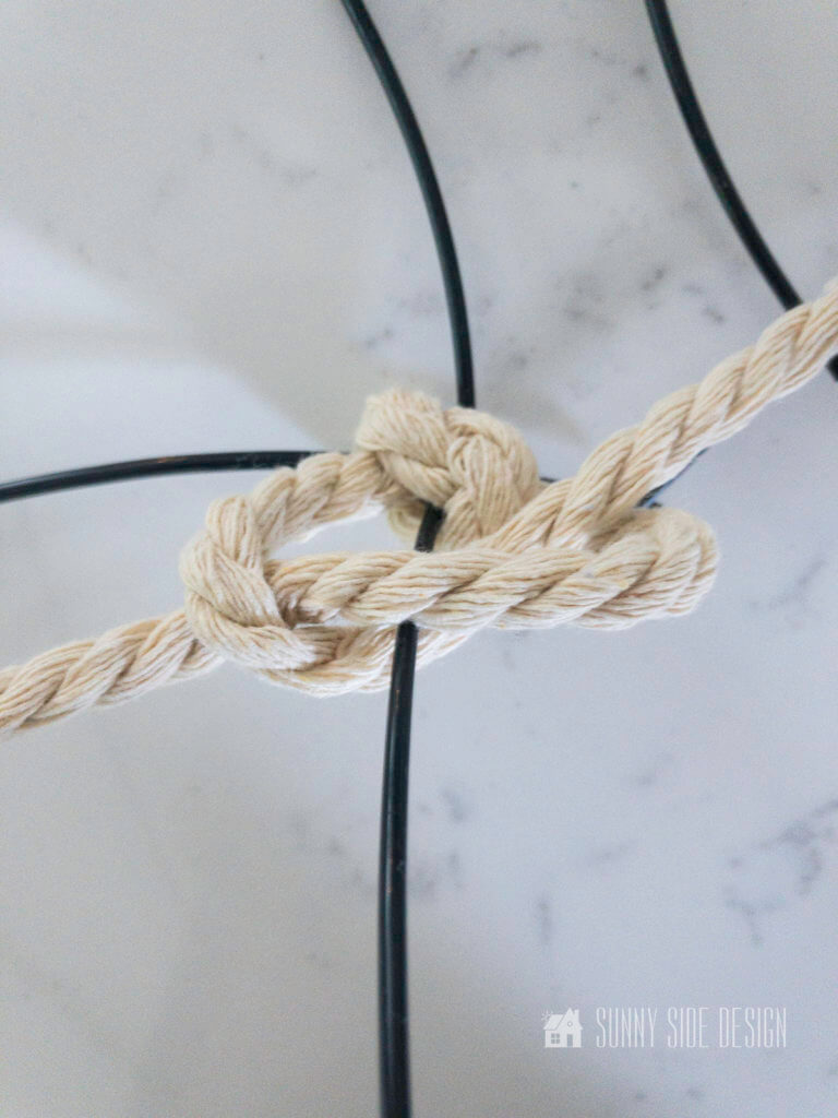 Pull spiral knot tight on pumpkin wire frame.