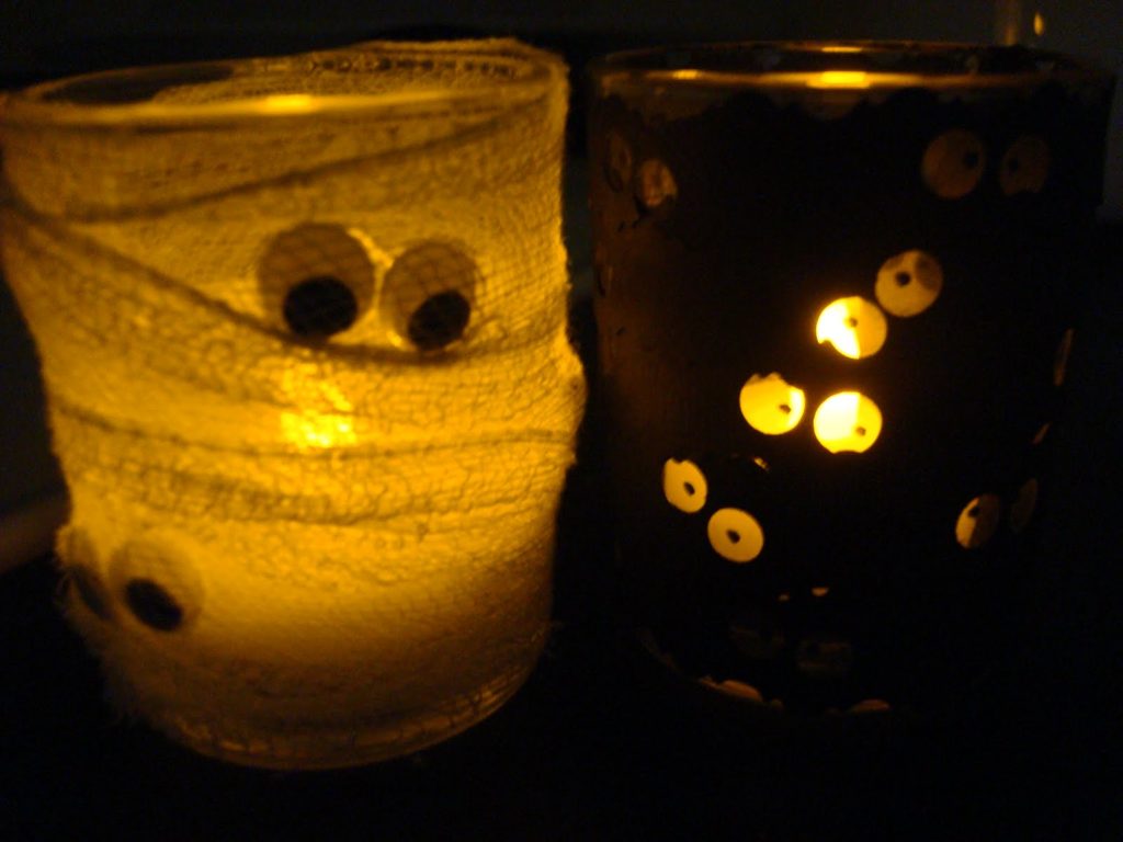 Monster eye votive, DIY Halloween decoration idea, lit by candlelight.
