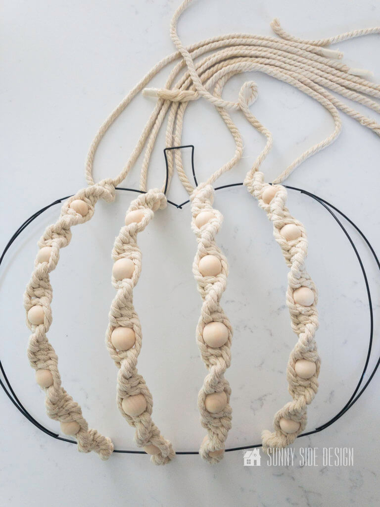 DIY Fall Macrame Wreath, 4 spiral knot rows completed