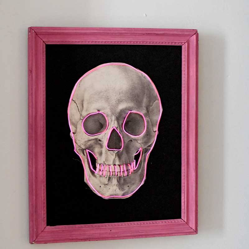 DIY Halloween Decorations - Glow in the dark neon pink skull in a hot pink frame.