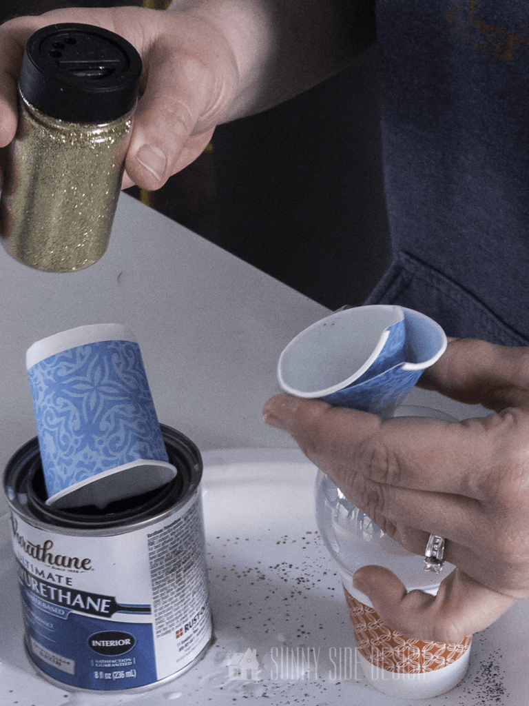 Use dry funnel to add glitter to the inside of the DIY glitter ornament.