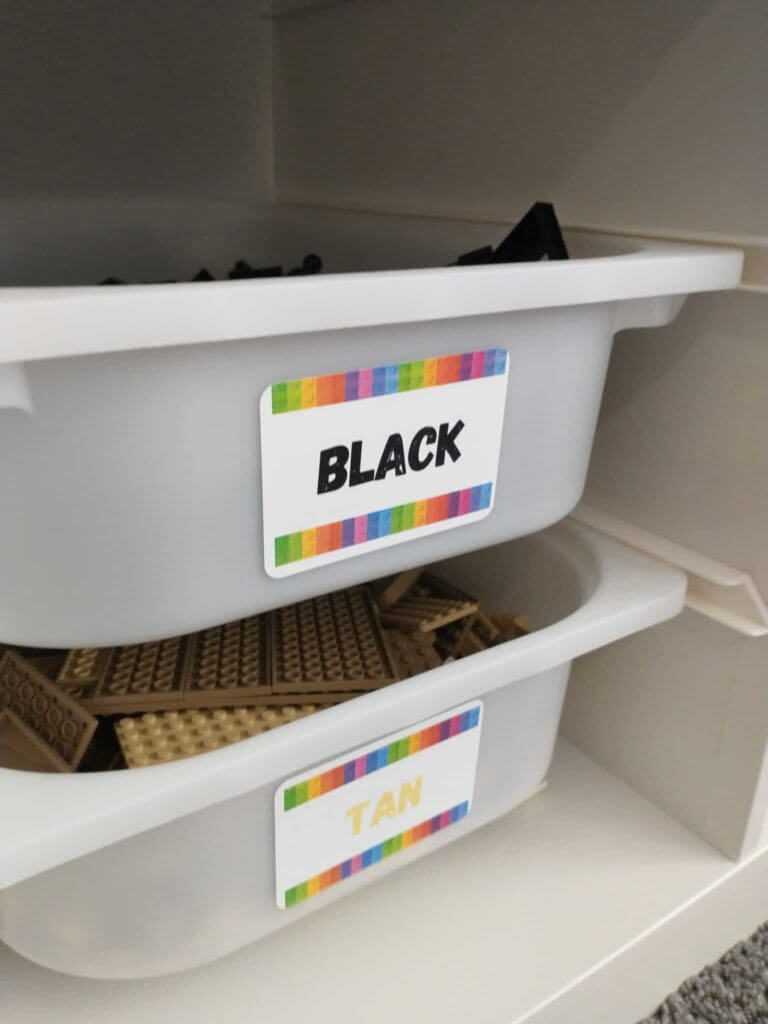 Lego toy storage idea, sliding plastic bins in a ikea container, labeled for each lego color.