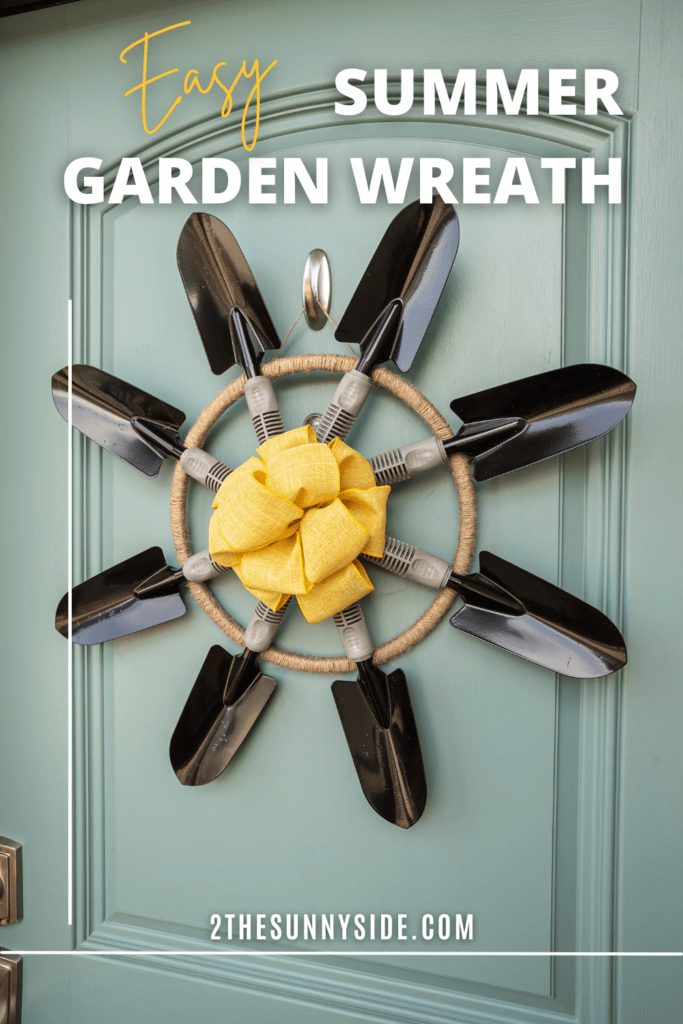Pinterest image 8 garden trowels forming a simple garden wreath hanging on a blue front door.