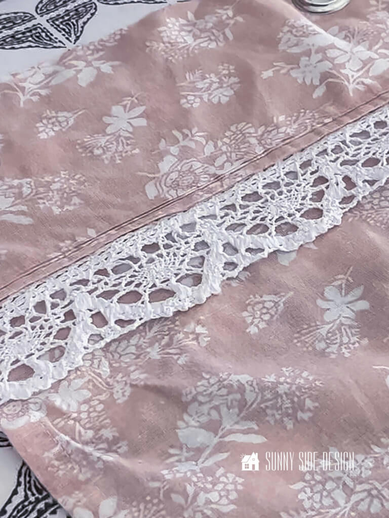 Lace trim at the top of the DIY shower curtain.