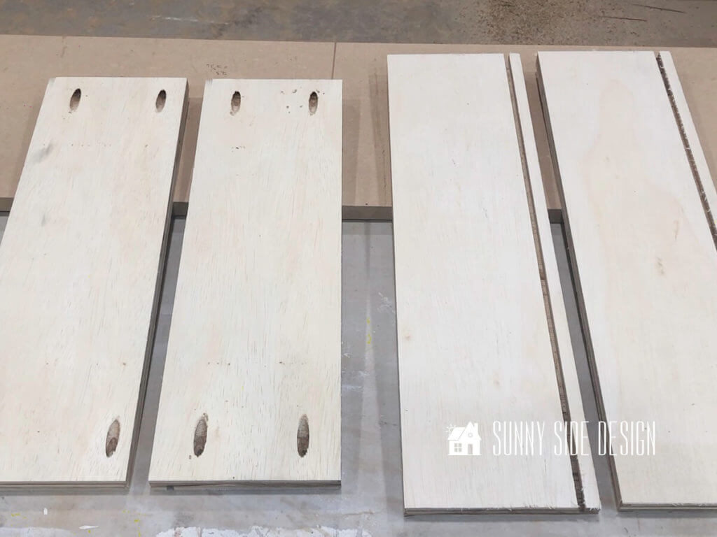 The 4 pieces of plywood to be used for building a drawer box, 2 with pocket holes.