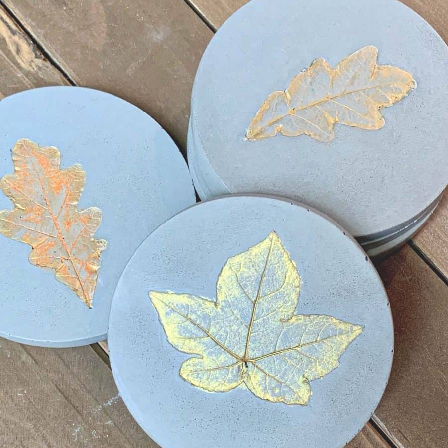 DIY Fall leaf Concrete coasters with maple, and oak leaves embossed into the concrete.