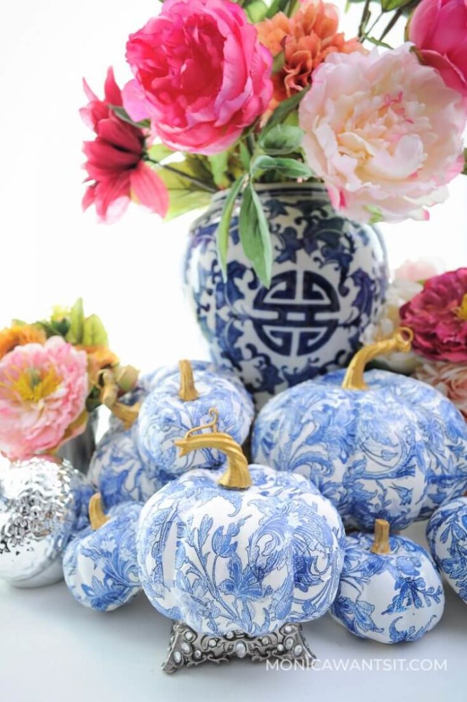 DIY Fall Decor ideas, decopaged blue and white pumpkins with a chinoiserie look styled with a blue and white ginger jar and pink peonies.