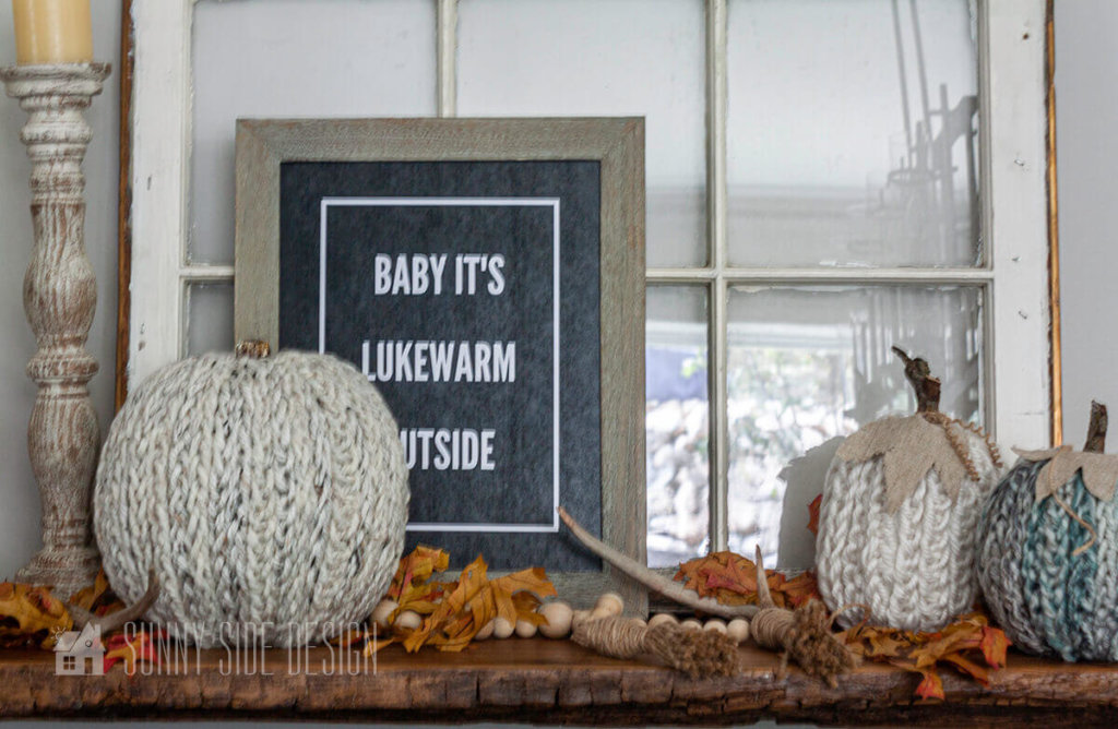 DIY Fall Decor ideas, finger knit pumpkin styled with a free printable fall sign against a vintage window. fall leaves and natural bead garland, with chippy finish candlesticks.