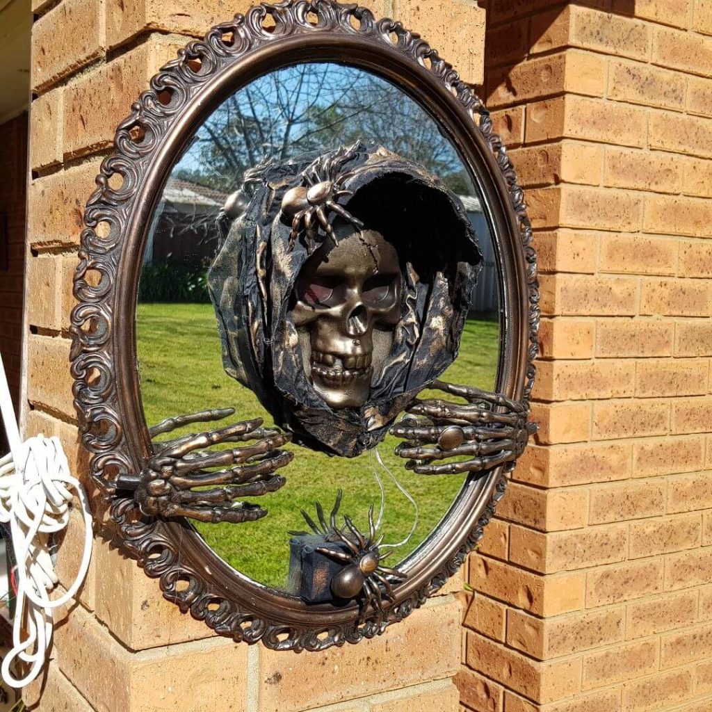 DIY 3-D skeleton mirror hung on the front porch.