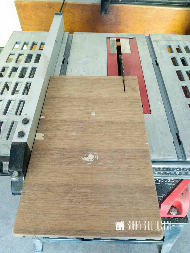Table saw cutting down the size of the walnut drawer front.