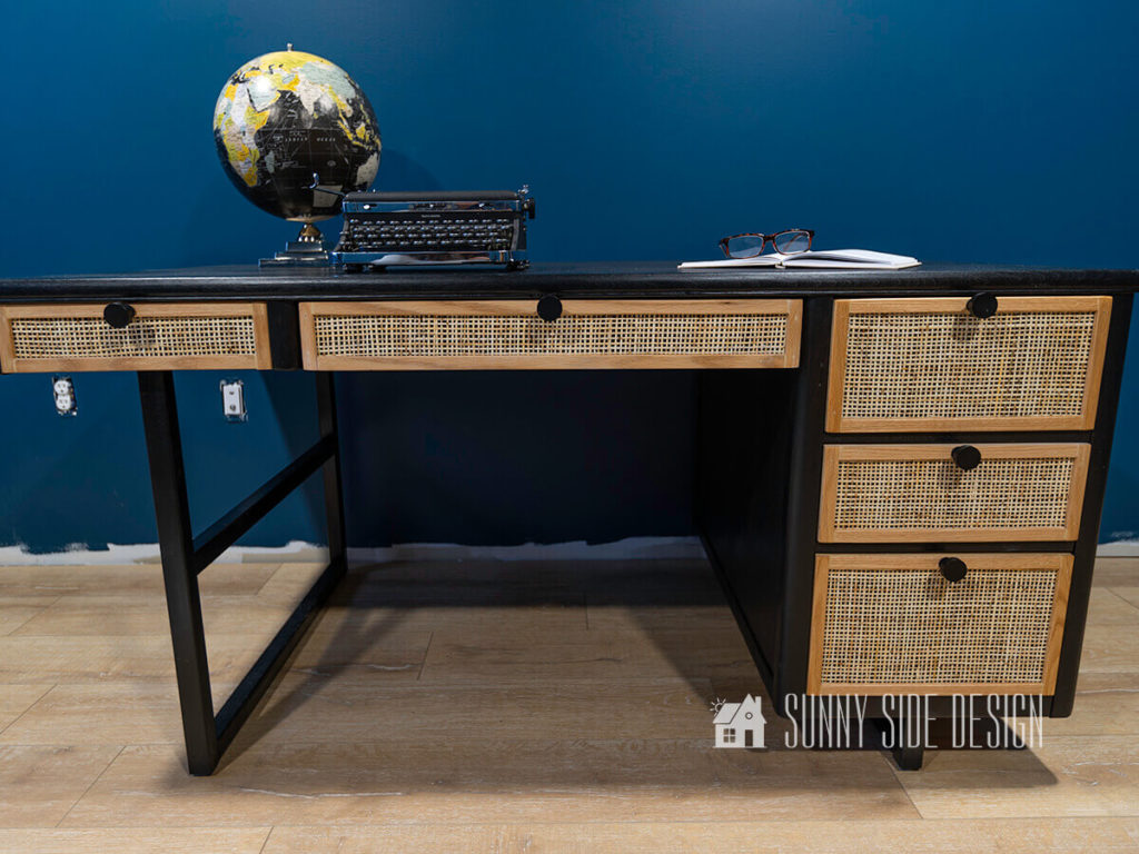 Finished Desk makover, black stained modern wood desk with rattan and oak trim drawer fronts with matte black drawer pulls.