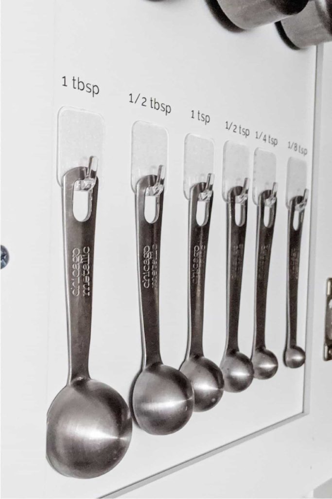 Small Kitchen Organization ideas, add hooks inside cabinet doors for more storage.