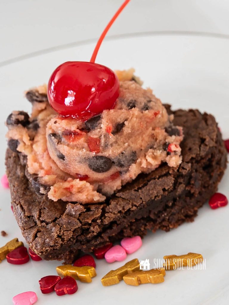 The best Fudgy Brownie Recipe with a Cherry Chocolate Chip Cookie Dough Frosting.