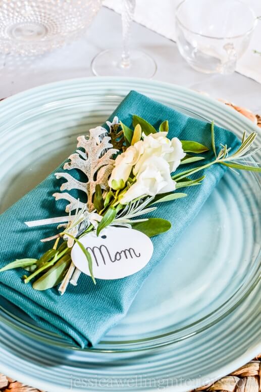 Fresh herbs ties together with a name tag for this pretty place card idea.