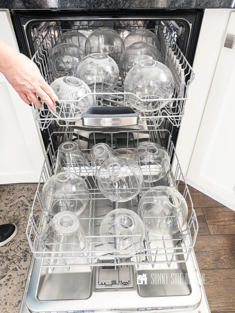 Place dirty glass globes and light fixtures in the dishwasher.