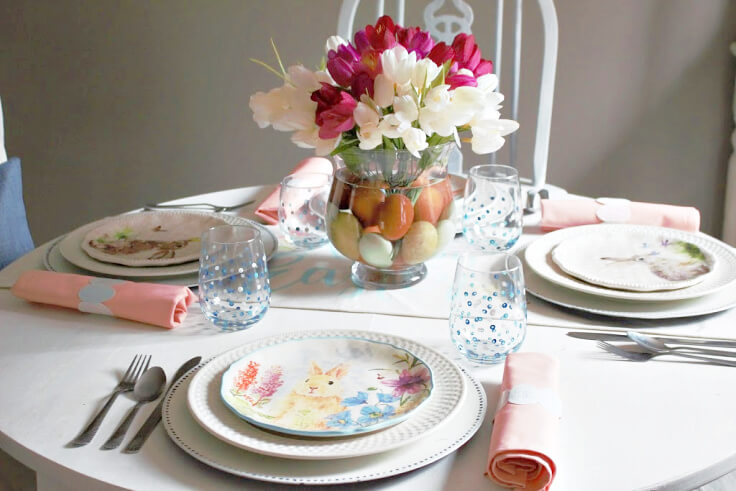 Fun bunny plates paired with tulips and eggs create a fun Easter tablescape.