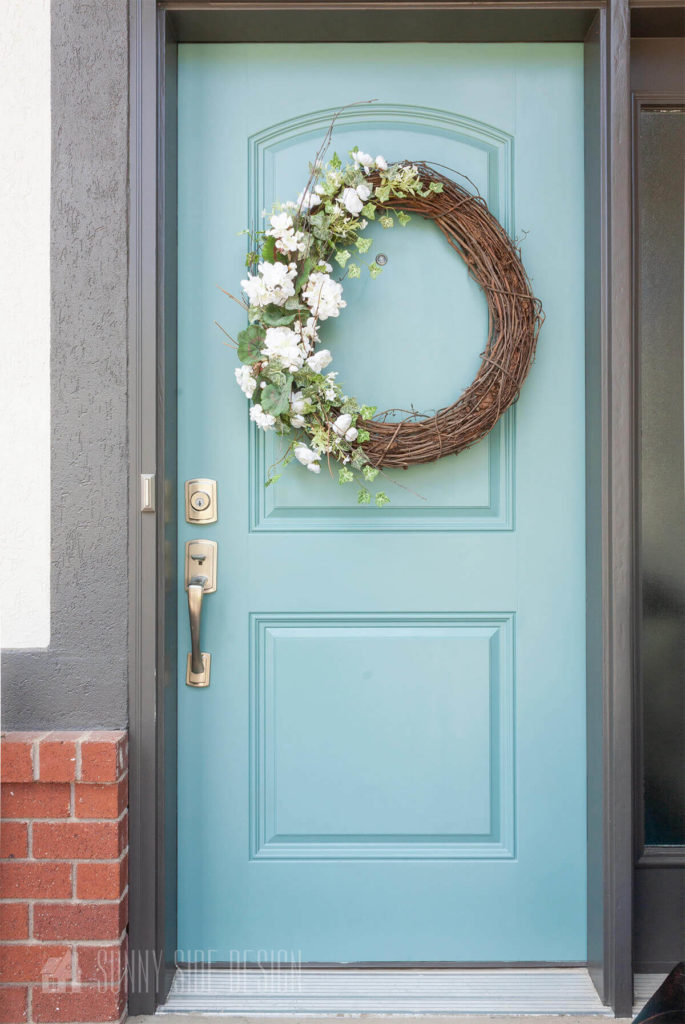 Add a beautiful wreath to the front door to welcome guests.