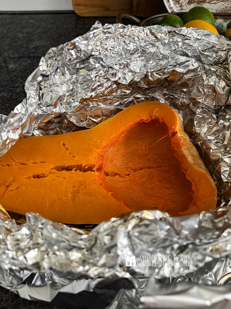 Remove foil from cooked butternut squash.