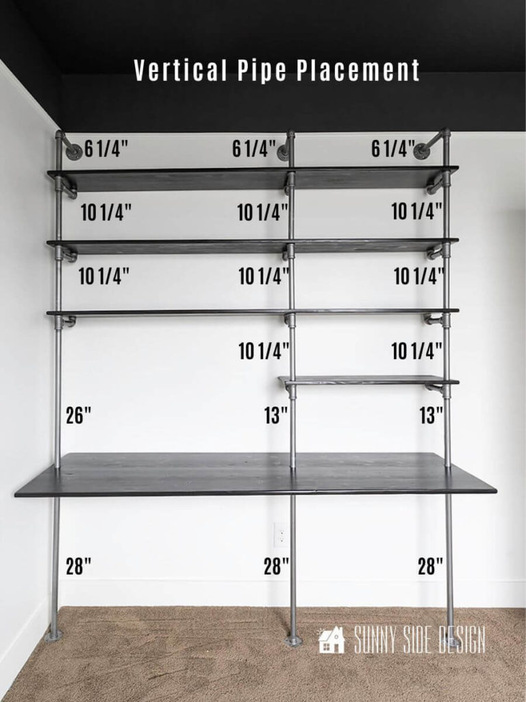 Image of industrial wood and pipe desk with measurements for placement of each vertical pipe.