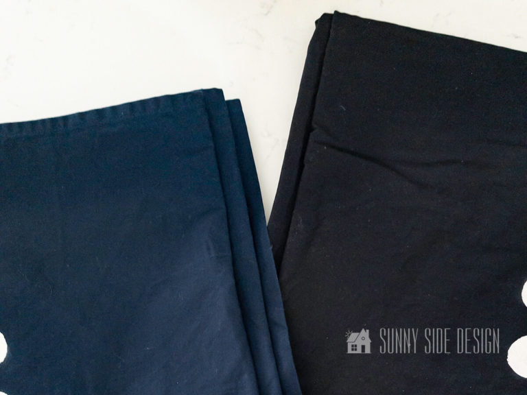 One drapery panel is dyed black, the other is navy blue before dyeing with Rit Dye.