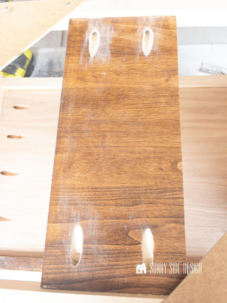 Pocket holes are drilled to secure a cleat for mounting the drawer side on.
