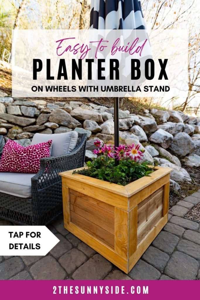 PINTEREST IMAGE, cedar planter box on patio with magenta dahlias, wicker furniture, black and white striped patio umbrella.
