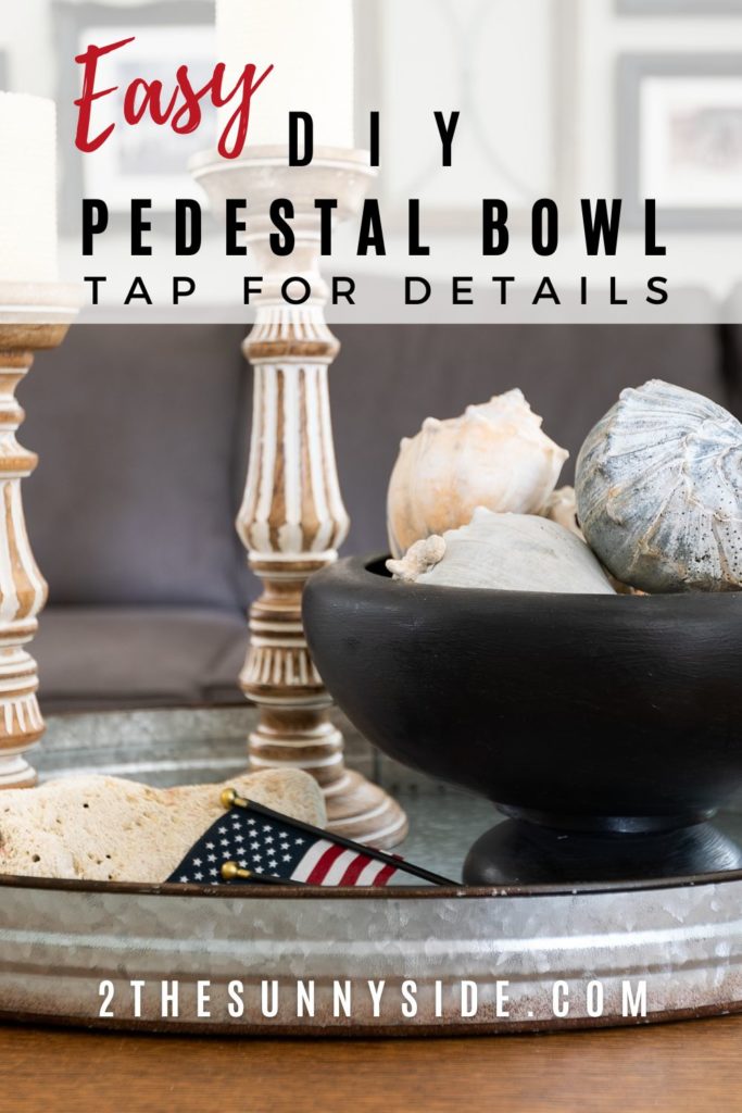 Pinterest image, DIY Pedestal Bowl Filled with Conch shells on a Galvanized Tray with Candlestick and American flag.