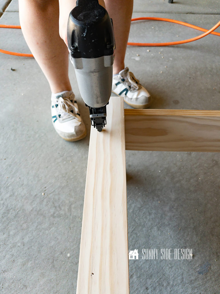 A pneumatic brad nailer is used to secure the cap to the footboard.