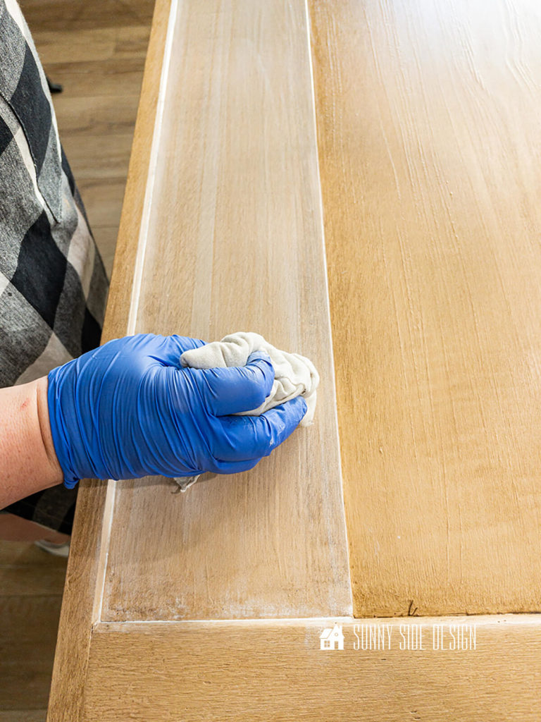 White wash glaze is wiped with a lint free cloth foe this faux wood grain finish.