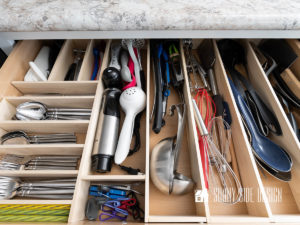 Custom wood DIY drawer dividers for eating and cooking utensils in a kitchen drawer.